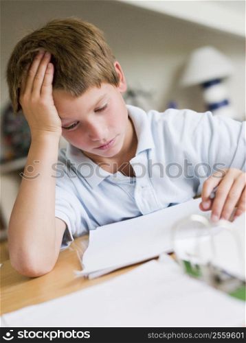 Young Boy Doing Homework In His Room