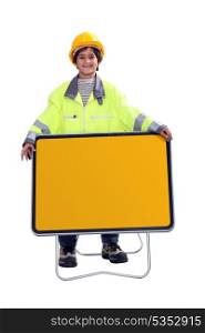 Young boy dressed as a construction worker
