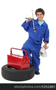 Young boy dressed as a mechanic