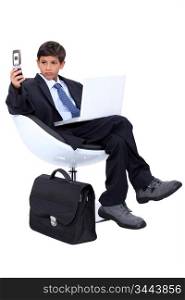 Young boy dressed as a surly businessman