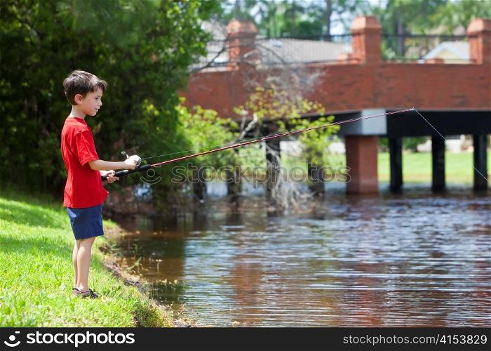 Young Boy Fishing On A RIver