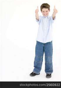 Young boy giving thumbs up smiling
