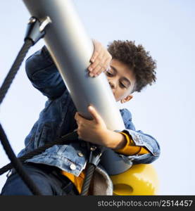 young boy having fun playground