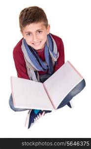 Young boy holding a skechbook over white background