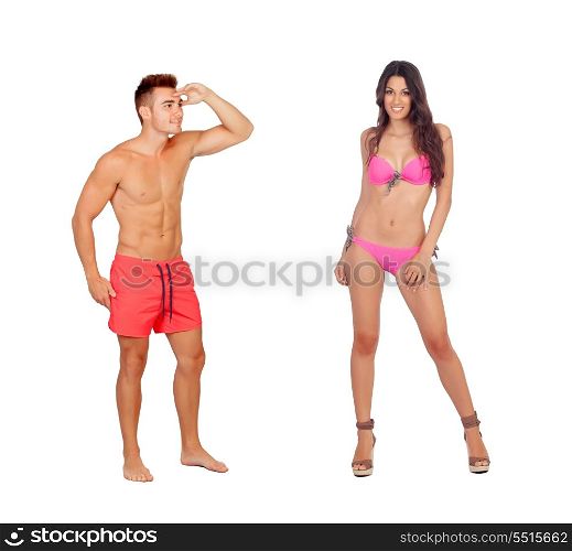 Young boy in swimwear looking at a sexy girl in bikini isolated on a white background