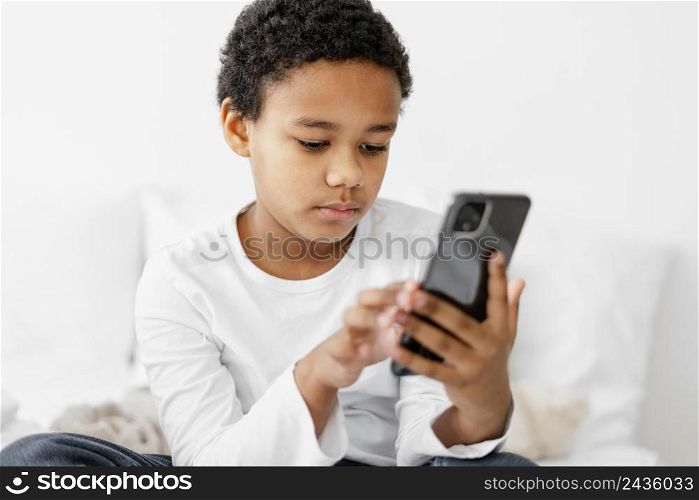 young boy kid using mobile 2