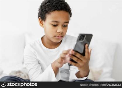 young boy kid using mobile 2