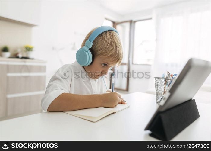 young boy paying attention online class 2
