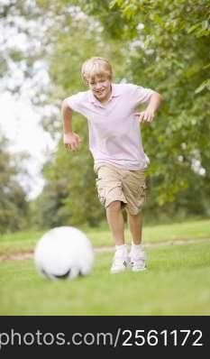 Young boy playing soccer