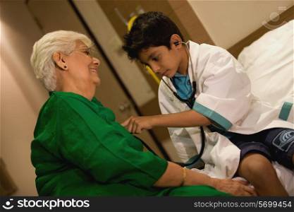 Young boy plays doctor