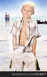 Young boy posing on the beach
