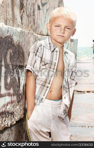 Young boy posing on the beach