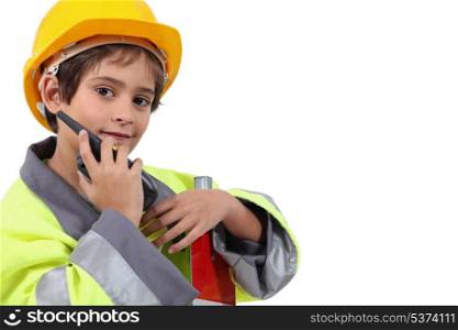 Young boy pretending to be a traffic guard