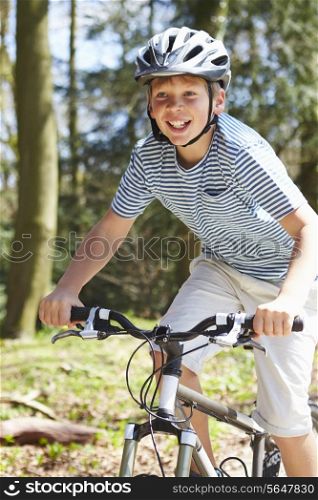 Young Boy Riding Bike Along Country Track