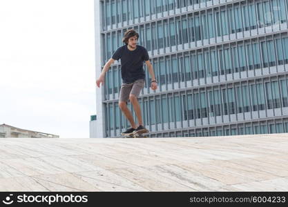 Young boy skateboarder at the local skatepark