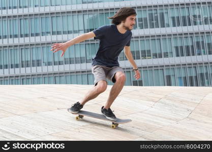 Young boy skateboarder at the local skatepark