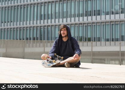 Young boy skateboarder at the local skatepark