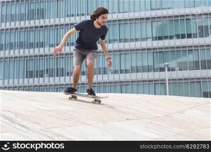 Young boy skateboarder at the local skatepark
