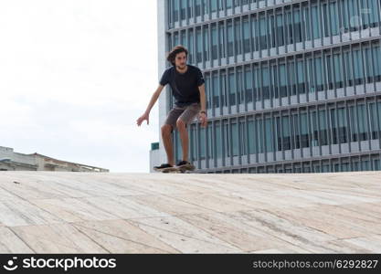 Young boy skateboarder at the local skatepark