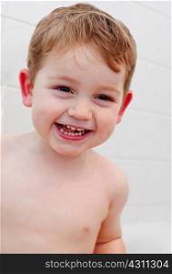 Young boy smiling in bathroom