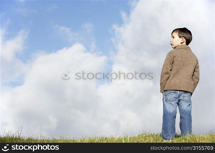 Young Boy Standing In The Park