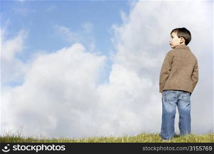 Young Boy Standing In The Park