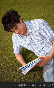 Young boy studying at the park