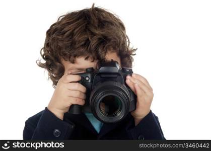 Young boy taking photo with camera over white background
