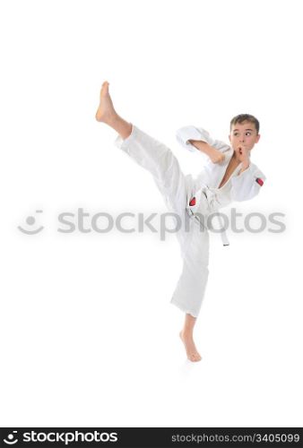 Young boy training karate. Isolated on white background