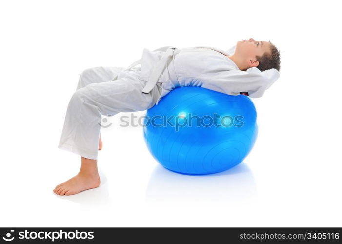 Young boy training karate. Isolated on white background