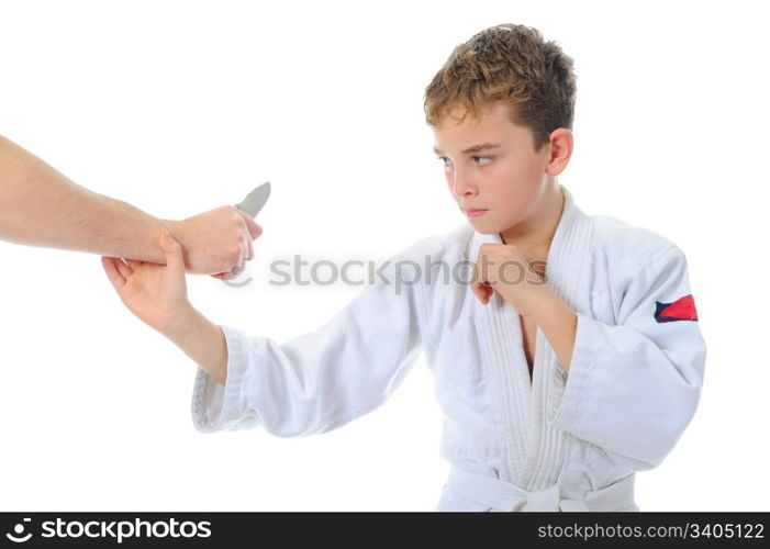 Young boy training karate. Isolated on white background