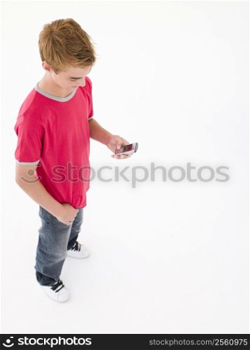 Young boy using cellular phone