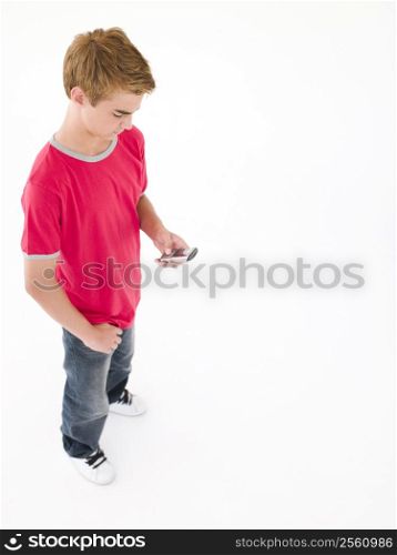 Young boy using cellular phone