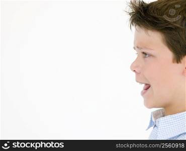 Young boy with mouth open