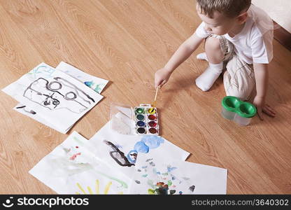 Young boy with paintbox