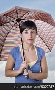 young brunette girl with umbrella in colors