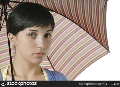 young brunette girl with umbrella, isolated