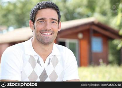 Young brunette in front of chalet