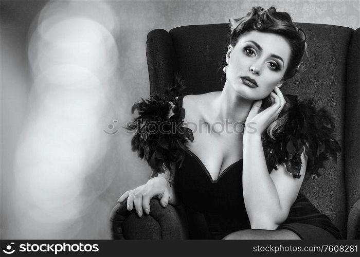 young brunette model girl and actress in a chair, black and white