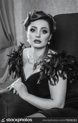 young brunette model girl and actress in a chair, black and white