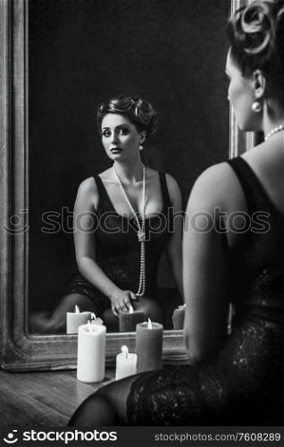 young brunette model girl and actress in front of a mirror, black and white