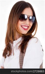 Young brunette model smiling with sunglasses on a white background