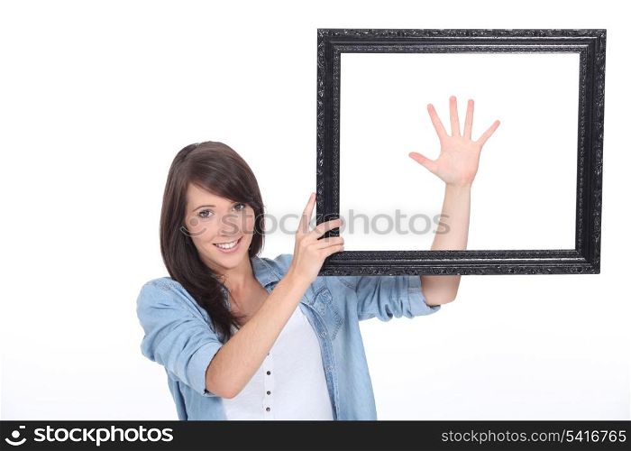 Young brunette with picture frame