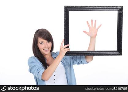 Young brunette with picture frame