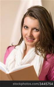 Young brunette woman hold student book wear pink jumper