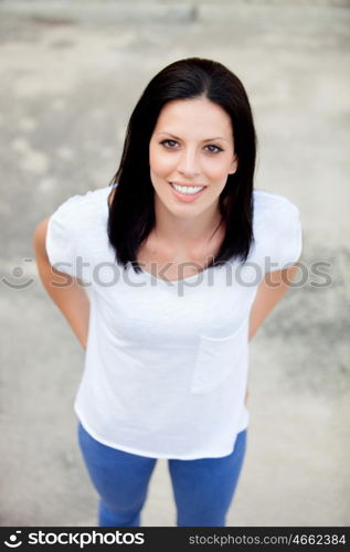 Young brunette woman on the street, seen from above