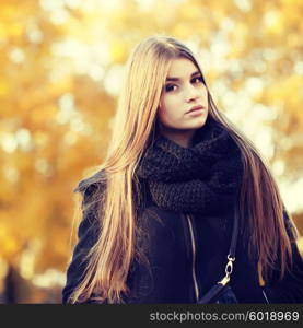 young brunette woman portrait in autumn color. colorful autumn portrait, street fashion.