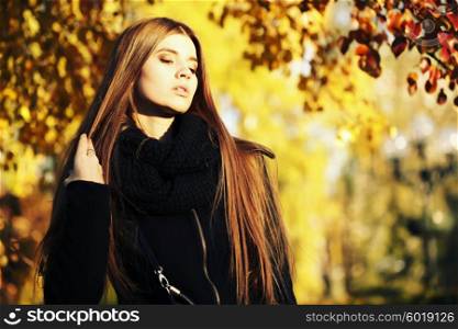 young brunette woman portrait in autumn color. colorful autumn portrait, street fashion.