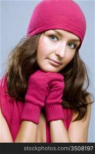young brunette woman posing in winter accessories