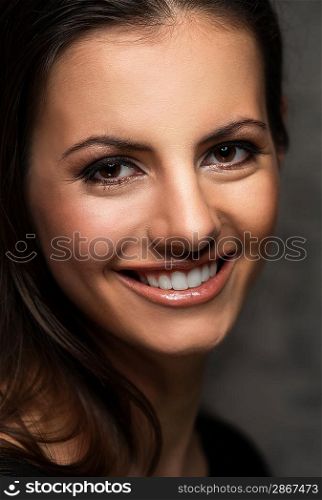 Young brunette woman with beautiful smile